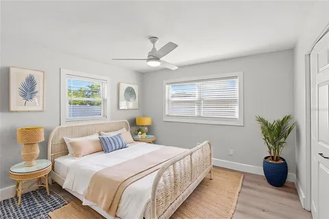 a spacious bedroom with a bed and a window
