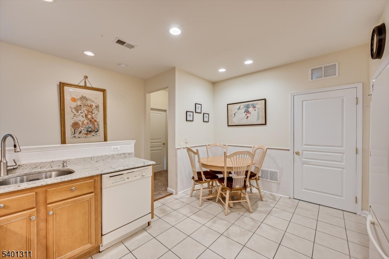 3108 Chesterwood Way Somerset, NJ 08873 - Photo 14 of 41 a view of a kitchen with dining area and entryway