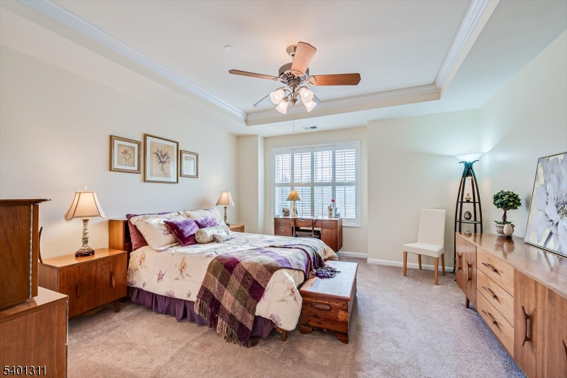 3108 Chesterwood Way Somerset, NJ 08873 - Photo 20 of 41 a bed room with a bed and a chandelier