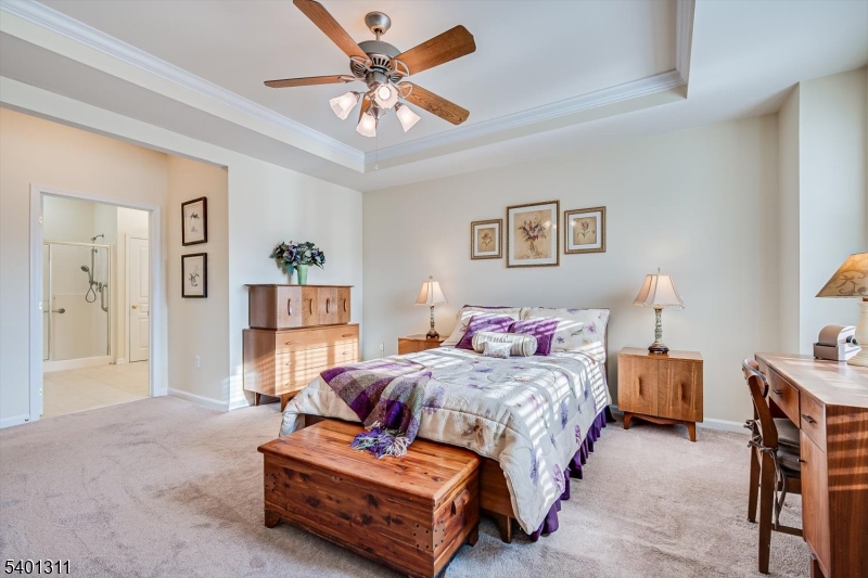 3108 Chesterwood Way Somerset, NJ 08873 - Photo 21 of 41 a bedroom with a bed and a chandelier