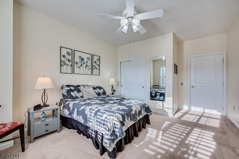 3108 Chesterwood Way Somerset, NJ 08873 - Photo 27 of 41 a bedroom with a bed and a chandelier