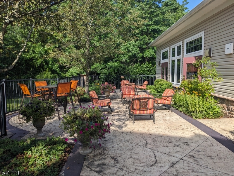 3108 Chesterwood Way Somerset, NJ 08873 - Photo 30 of 41 a view of a patio with chairs and potted plants