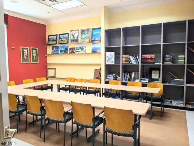 a view of a kitchen with a dining table and chairs
