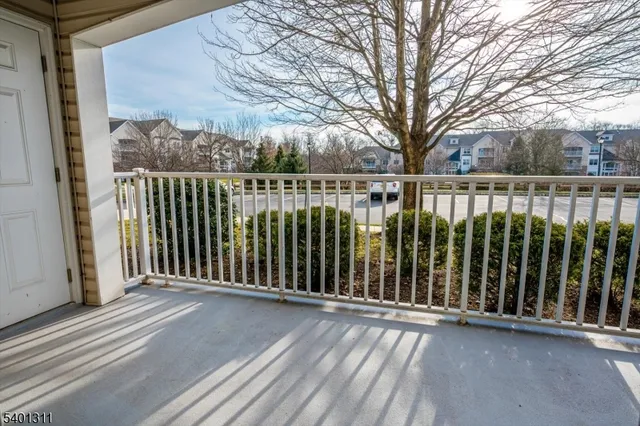 a view of a balcony with a trees