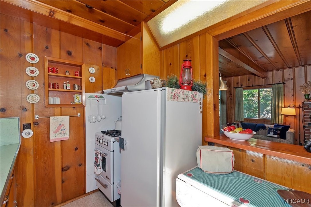 620 Cedar Lane Twin Peaks, CA 92391 - Photo 15 of 31 a room with stainless steel appliances a refrigerator and a table