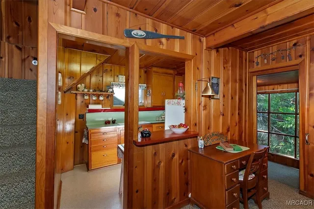 a bed room with a bed and a chair