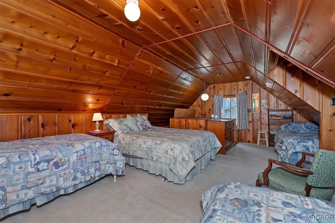 620 Cedar Lane Twin Peaks, CA 92391 - Photo 19 of 31 a spacious bedroom with two beds and a couch