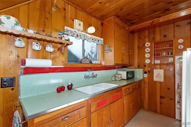 a bathroom with mirror and sink