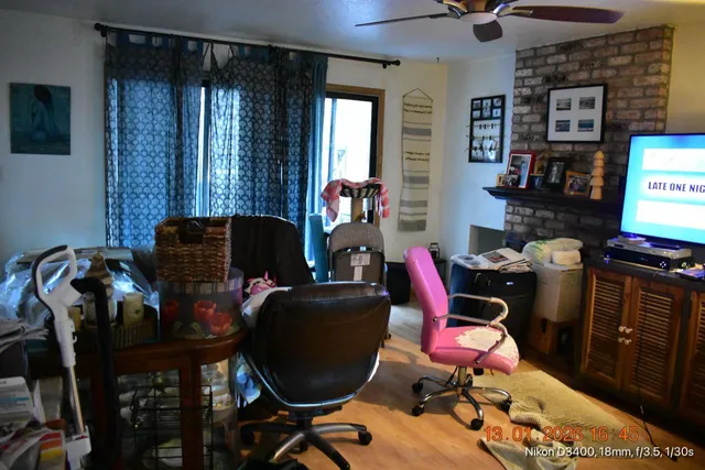 a room with furniture and musical instruments