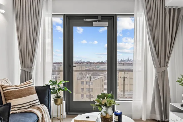 a room with furniture and a potted plant