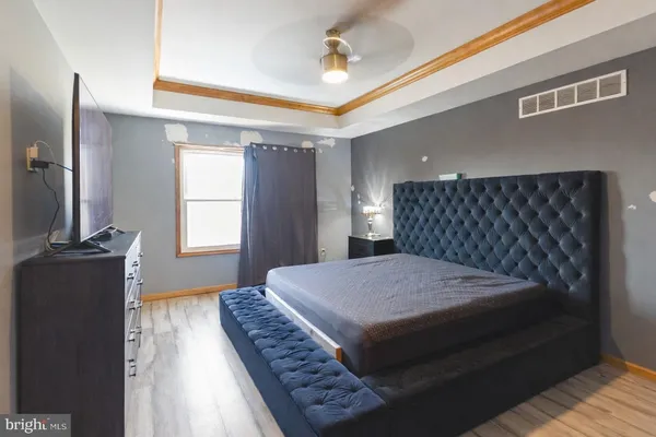 a bedroom with a bed and window