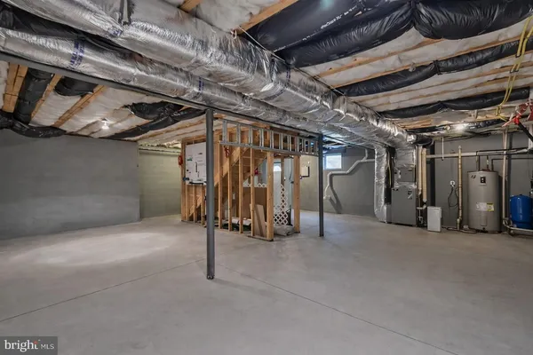 a view of an empty room with wooden walls
