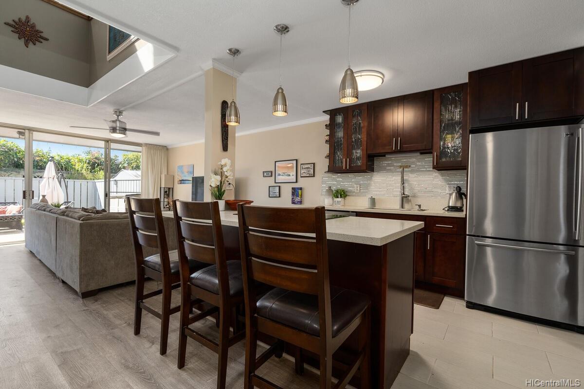a kitchen with a dining table and chairs