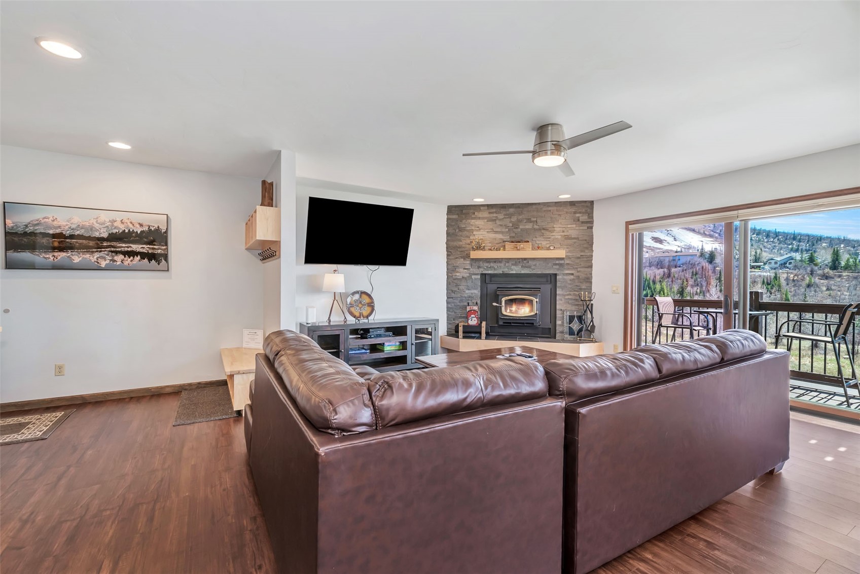 1720 Ranch Road, Unit 309 Steamboat Springs, CO 80487 - Photo 11 of 43 a living room with furniture and a flat screen tv