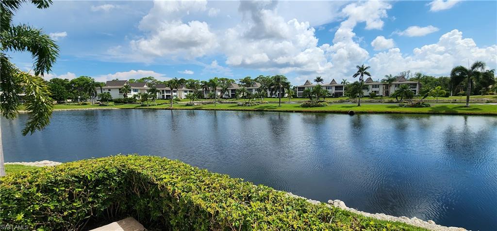 102 Georgetown Boulevard, Unit 102 Naples, FL 34112 - Photo 2 of 29 a view of lake
