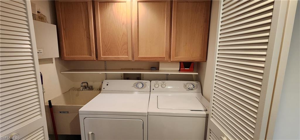 102 Georgetown Boulevard, Unit 102 Naples, FL 34112 - Photo 21 of 29 a utility room with dryer and washer