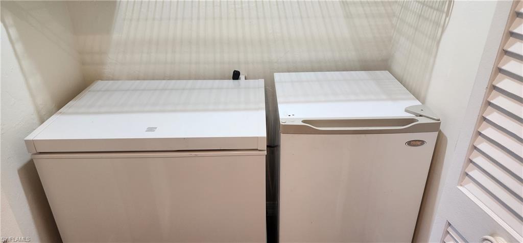 102 Georgetown Boulevard, Unit 102 Naples, FL 34112 - Photo 22 of 29 a utility room with dryer and washer