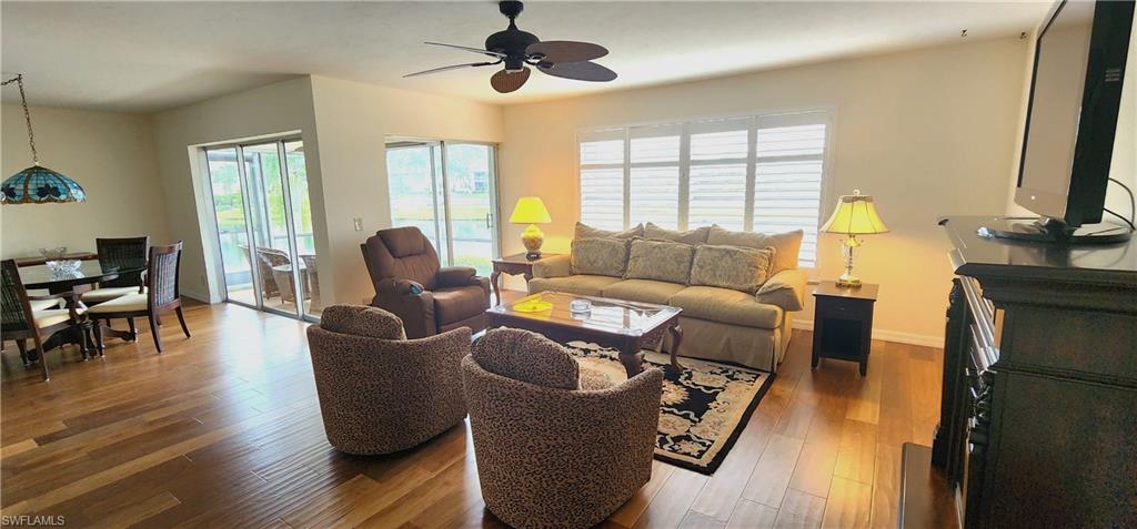 102 Georgetown Boulevard, Unit 102 Naples, FL 34112 - Photo 4 of 29 a living room with furniture and a window