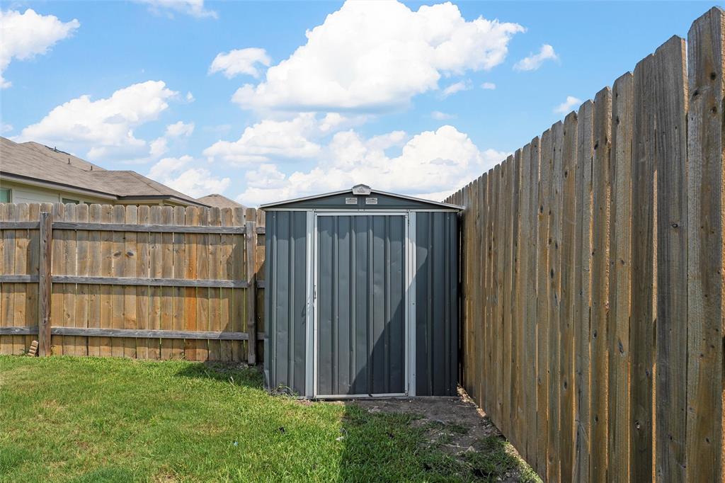 3217 Beutel Road Lorena, TX 76655 - Photo 33 of 40 View of shed with a fenced backyard