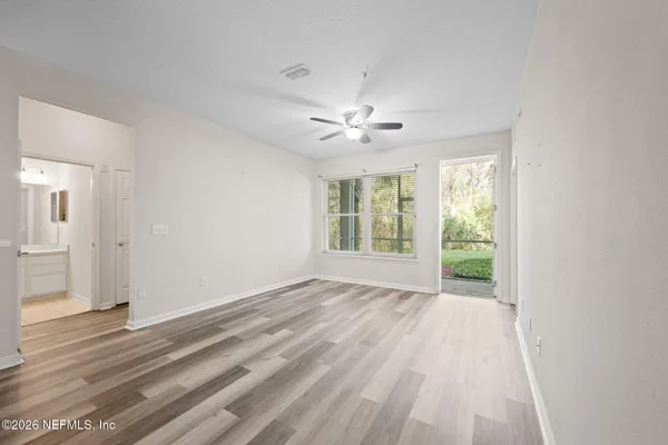 a view of an empty room with a window