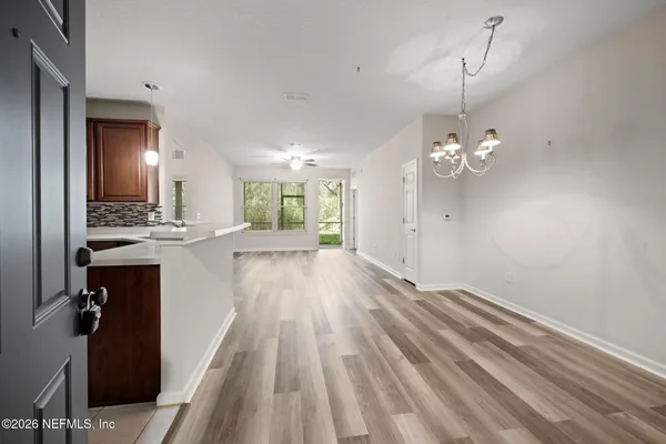 a view of a kitchen from the hallway