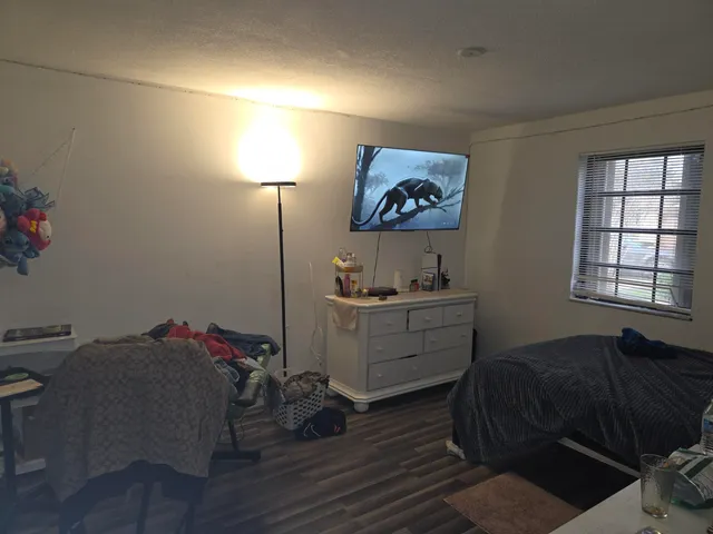 a bed room with a bed and a window