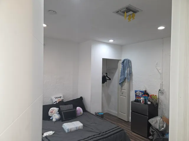 a room with furniture and wooden floor