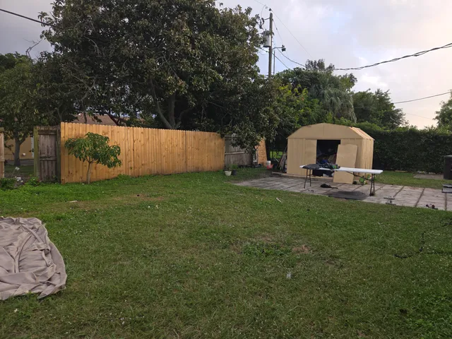 a view of a backyard with sitting area