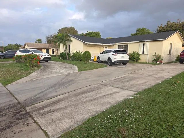 a car parked in front of a house
