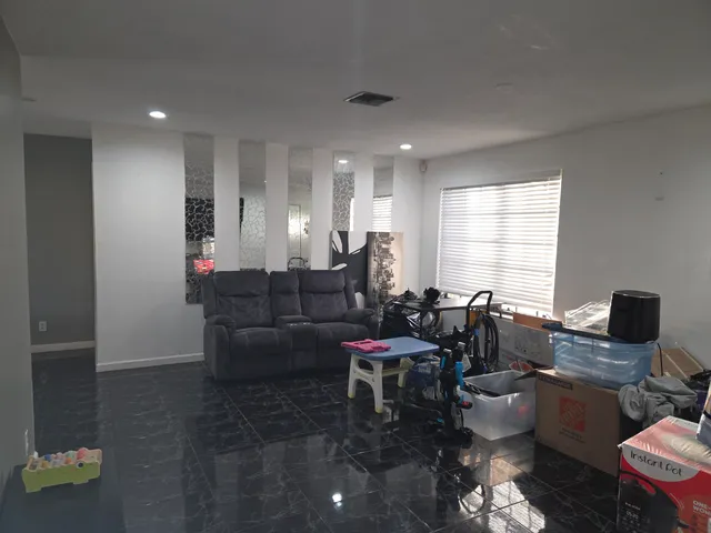 a living room with furniture and window