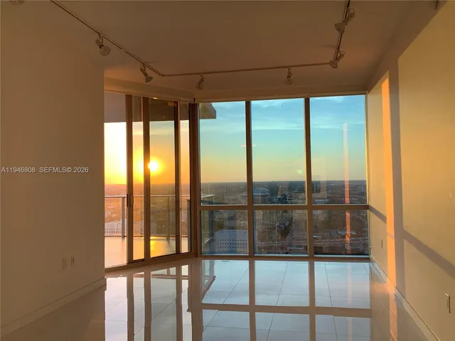 a view of a swimming pool with outdoor seating