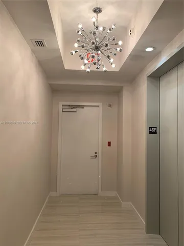 a kitchen with stainless steel appliances granite countertop a sink a stove and a wooden floors