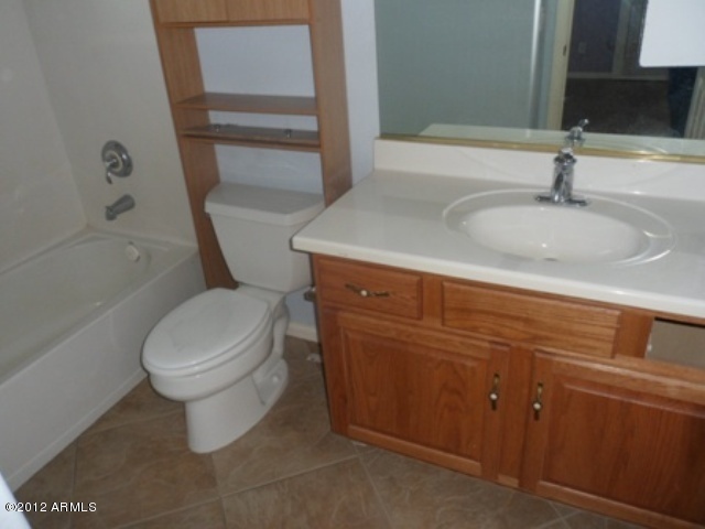 3469 East Cabazon Court Gilbert, AZ 85297 - Photo 11 of 25 a bathroom with a sink and a toilet