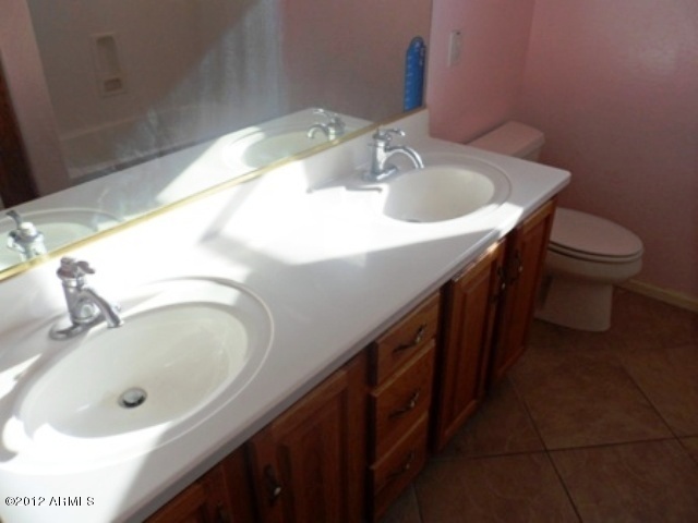3469 East Cabazon Court Gilbert, AZ 85297 - Photo 13 of 25 a bathroom with a sink and a toilet