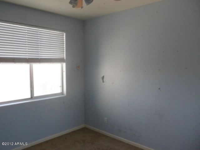 3469 East Cabazon Court Gilbert, AZ 85297 - Photo 15 of 25 an empty room with a window
