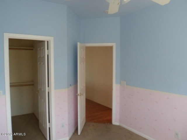 3469 East Cabazon Court Gilbert, AZ 85297 - Photo 17 of 25 a view of a hallway with an empty room