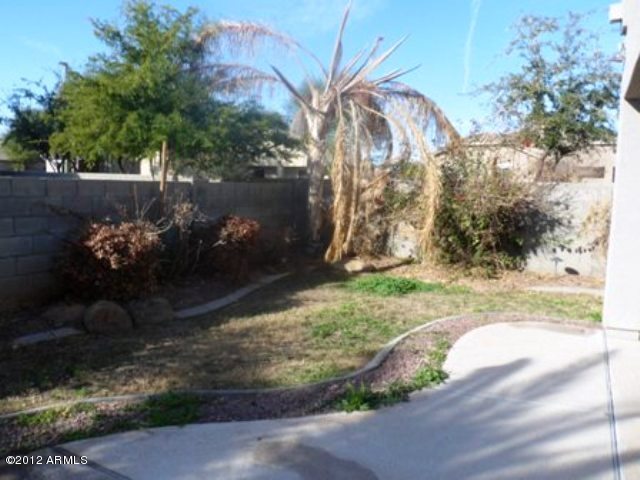 3469 East Cabazon Court Gilbert, AZ 85297 - Photo 22 of 25 a backyard of a house with lots of green space