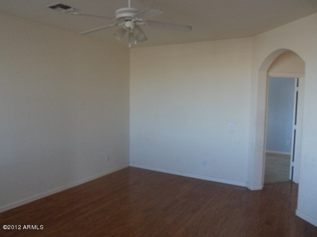 3469 East Cabazon Court Gilbert, AZ 85297 - Photo 25 of 25 an empty room with a fan & a window