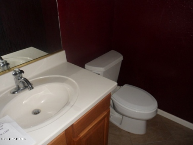 3469 East Cabazon Court Gilbert, AZ 85297 - Photo 10 of 25 a bathroom with a sink and a toilet