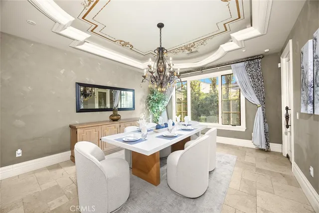 a view of a porch with furniture and floor to ceiling window