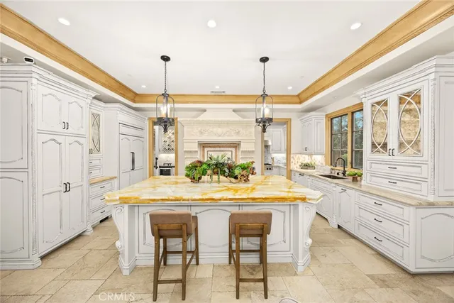 a spacious kitchen with a stove and a sink