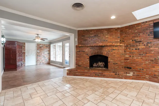 a view of livingroom with fireplace and window
