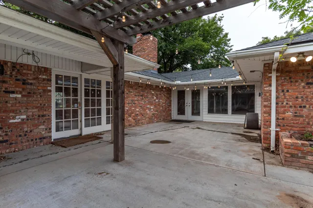 a front view of a house with a large window