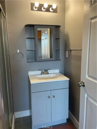 a bathroom with a sink and a mirror