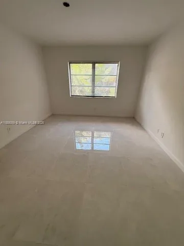 a bathroom with a granite countertop sink a toilet a mirror and shower