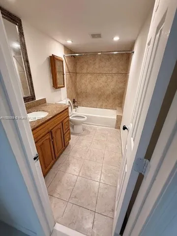 a view of an empty room with windows