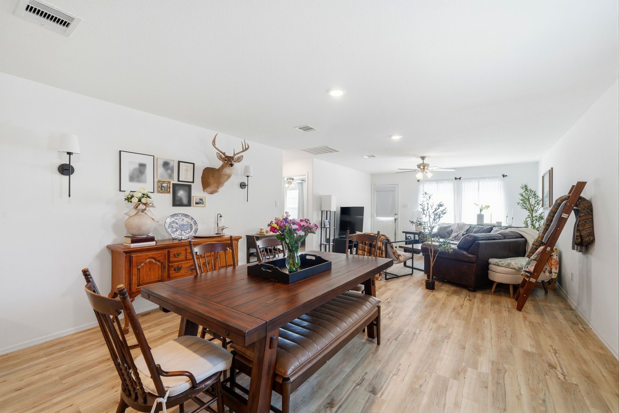 14502 Woodcott Warren Way Rosharon, TX 77583 - Photo 16 of 29 Bright, airy, and inviting — vinyl plank flooring flows throughout with no carpet, creating a clean, low-maintenance living space