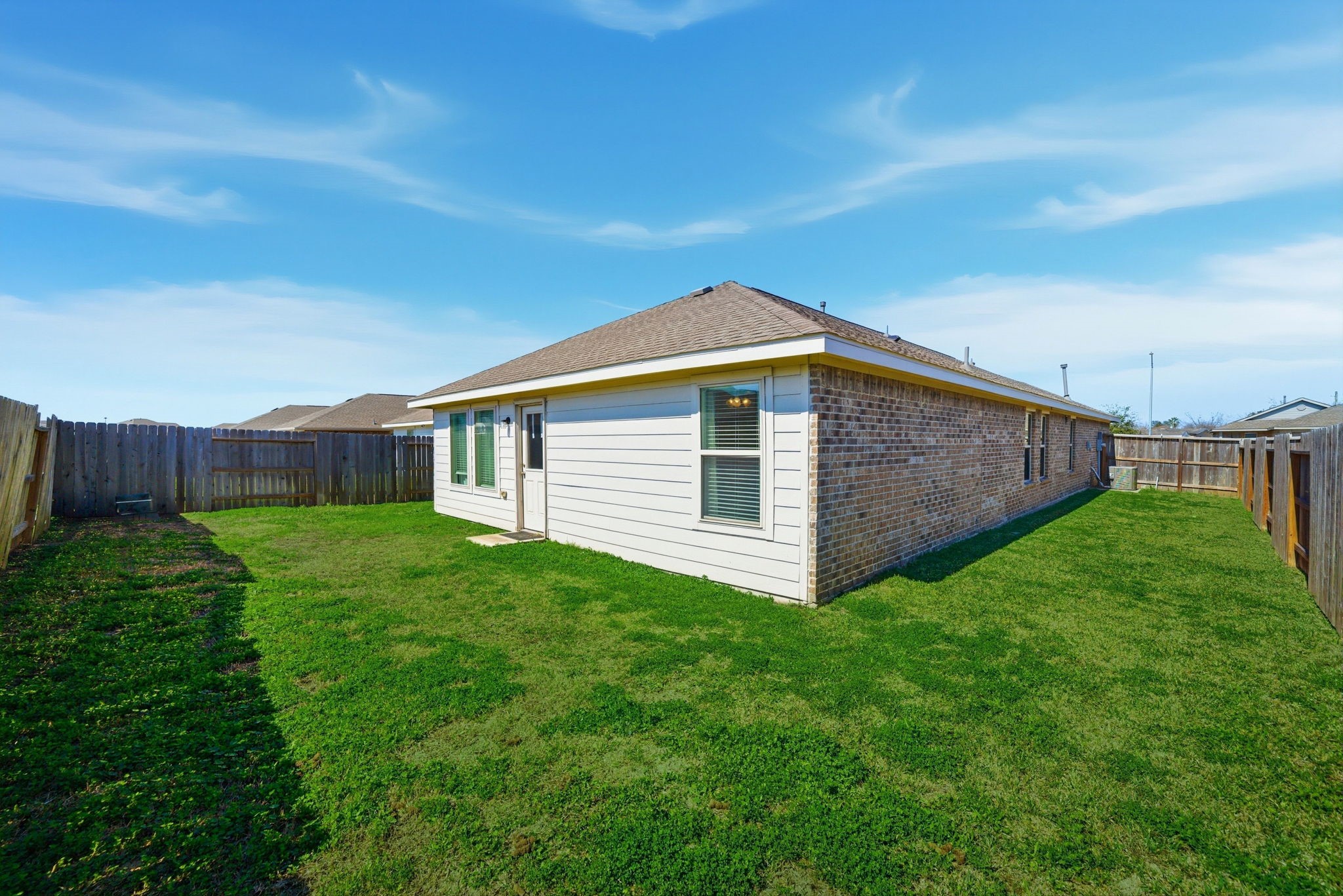 14502 Woodcott Warren Way Rosharon, TX 77583 - Photo 22 of 29 Generously sized backyard offering ample space to relax, entertain, or personalize to your liking.