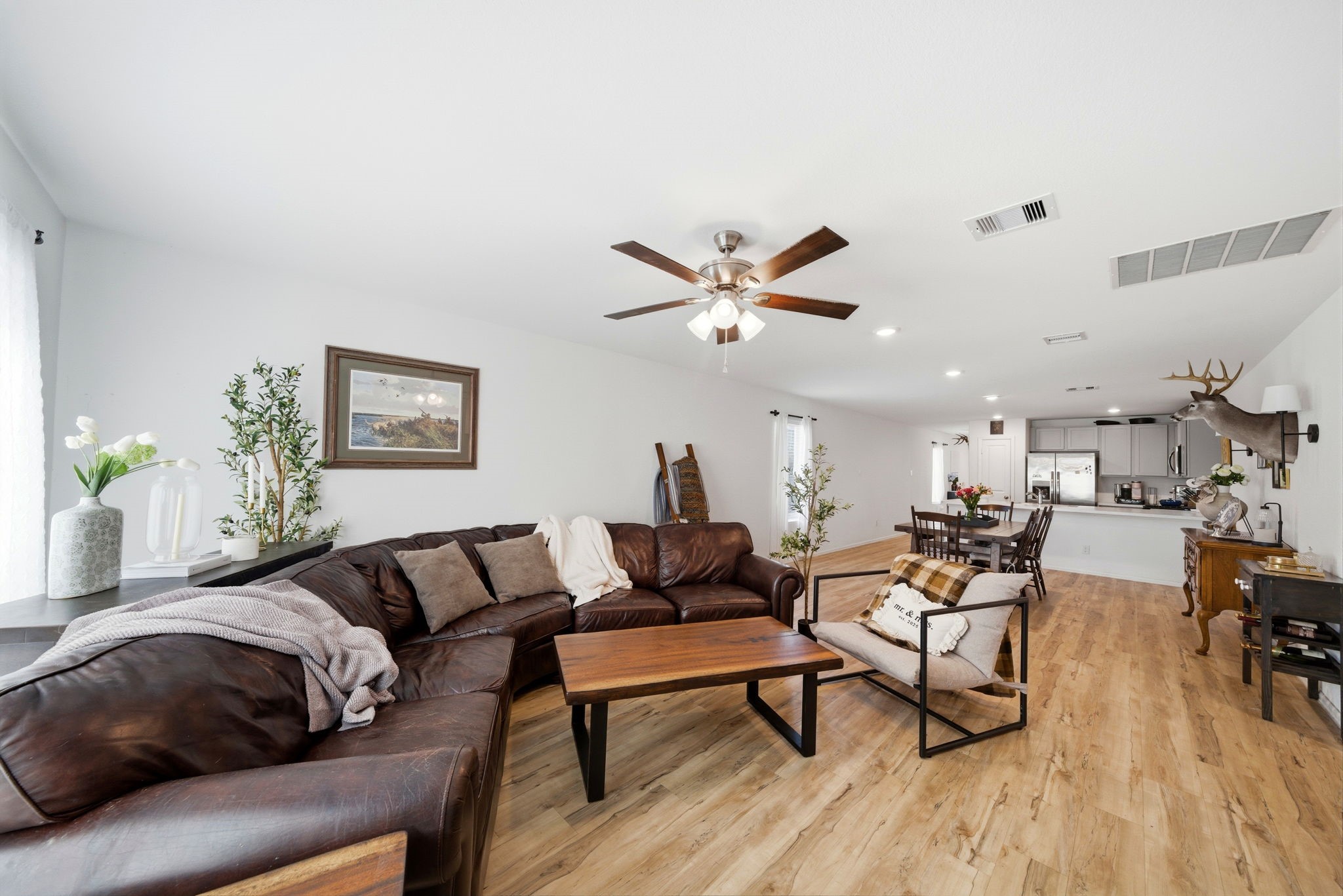 14502 Woodcott Warren Way Rosharon, TX 77583 - Photo 4 of 29 Designed for connection, this spacious living room opens effortlessly to the dining and kitchen areas.