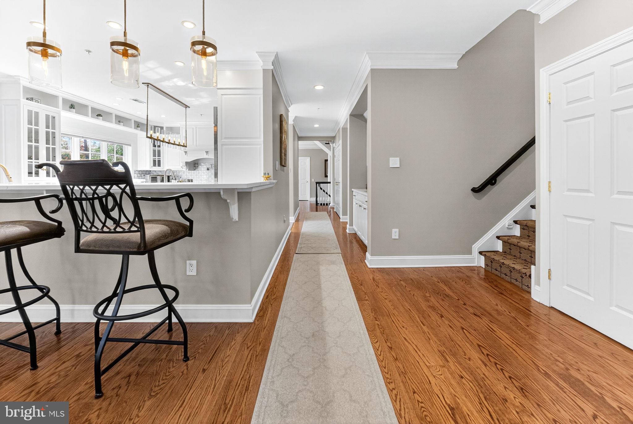 5765 Valley Stream Drive Doylestown, PA 18902 - Photo 18 of 60 Back hallway and 2nd staircase